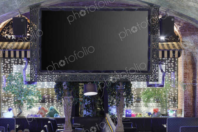 Interior view of a flat screen TV in restaurant.