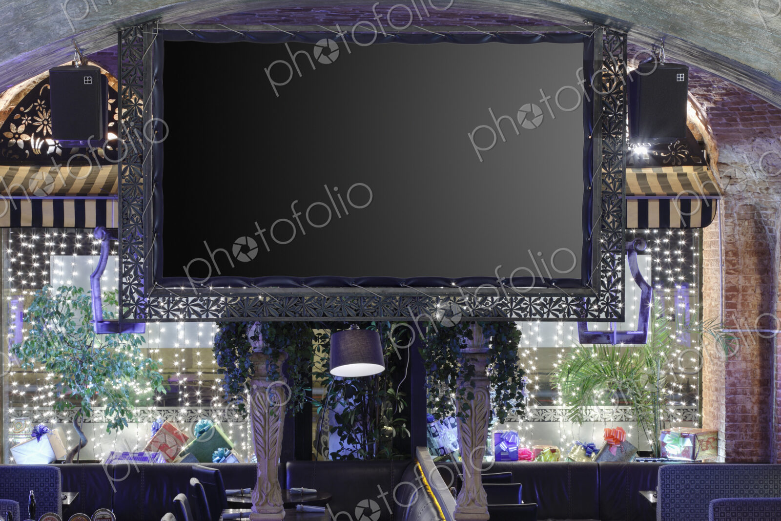 Interior view of a flat screen TV in restaurant.