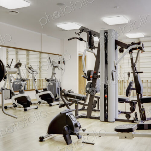 Interior view of a gymnasium, with exercise equipment. Interior view of a gymnasium, with exercise equipment.