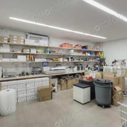 Interior view of a storeroom in an office building with stacks of paper and cardboard… Interior view of a storeroom in an office building with stacks of paper and cardboard…