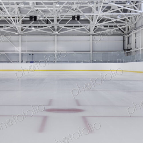 Interior view of an ice rink with ice hockey markings