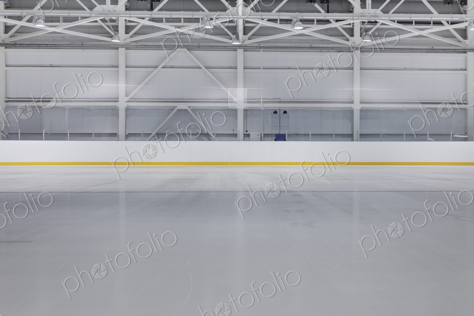 Interior view of an ice rink with ice hockey markings.