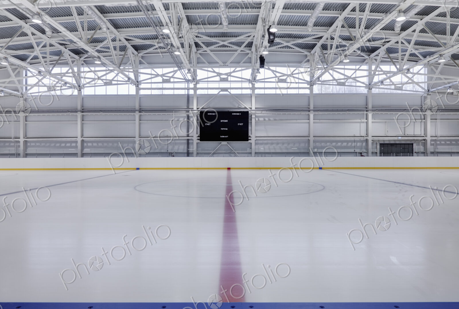 Interior view of an ice rink with ice hockey markings.