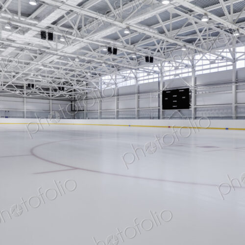 Interior view of an ice rink with ice hockey markings.