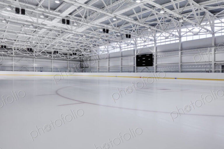 Interior view of an ice rink with ice hockey markings.