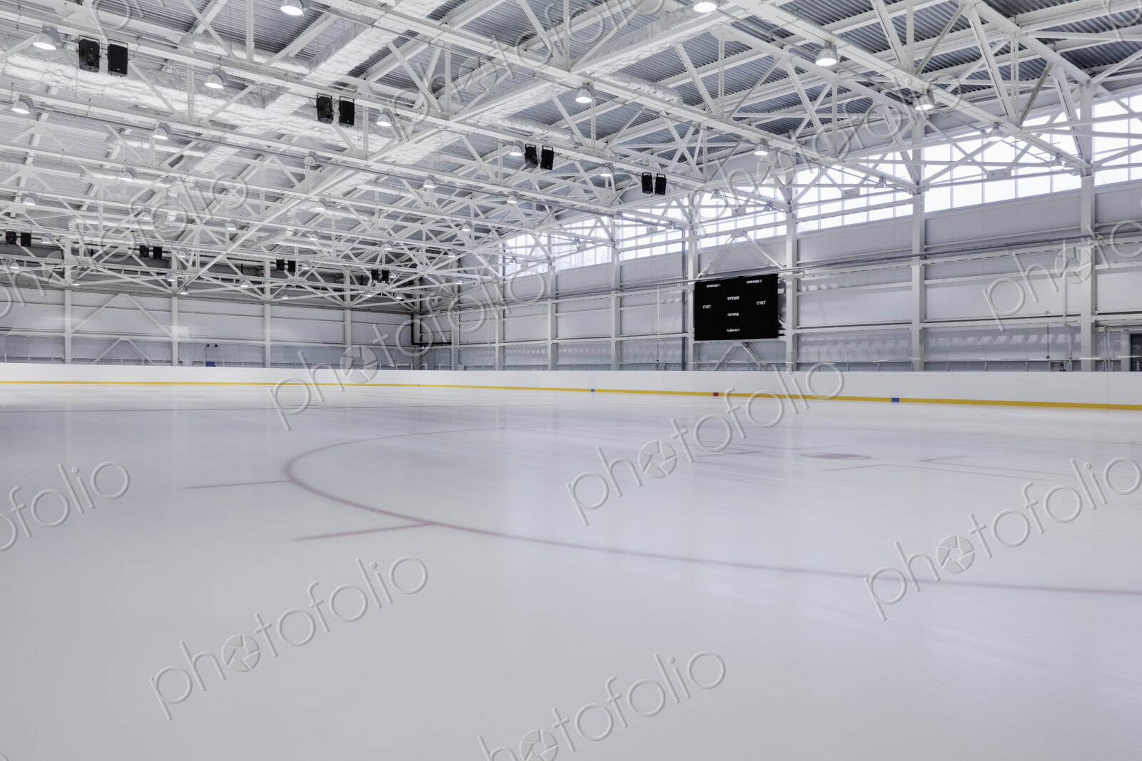 Interior view of an ice rink with ice hockey markings.