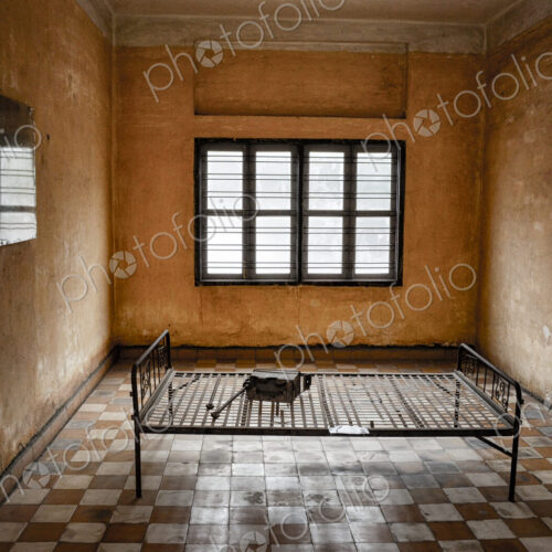 Interior view of prison cell at the Tuol Sleng Genocide Museum, Phnom Penh, Cambodia. Interior view of prison cell at the Tuol Sleng Genocide Museum, Phnom Penh, Cambodia.