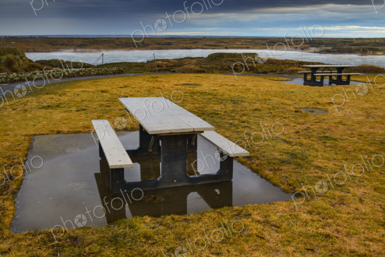 Interstate 90 Highway rest stop and picnic tables at Sprague overlooking a lake.