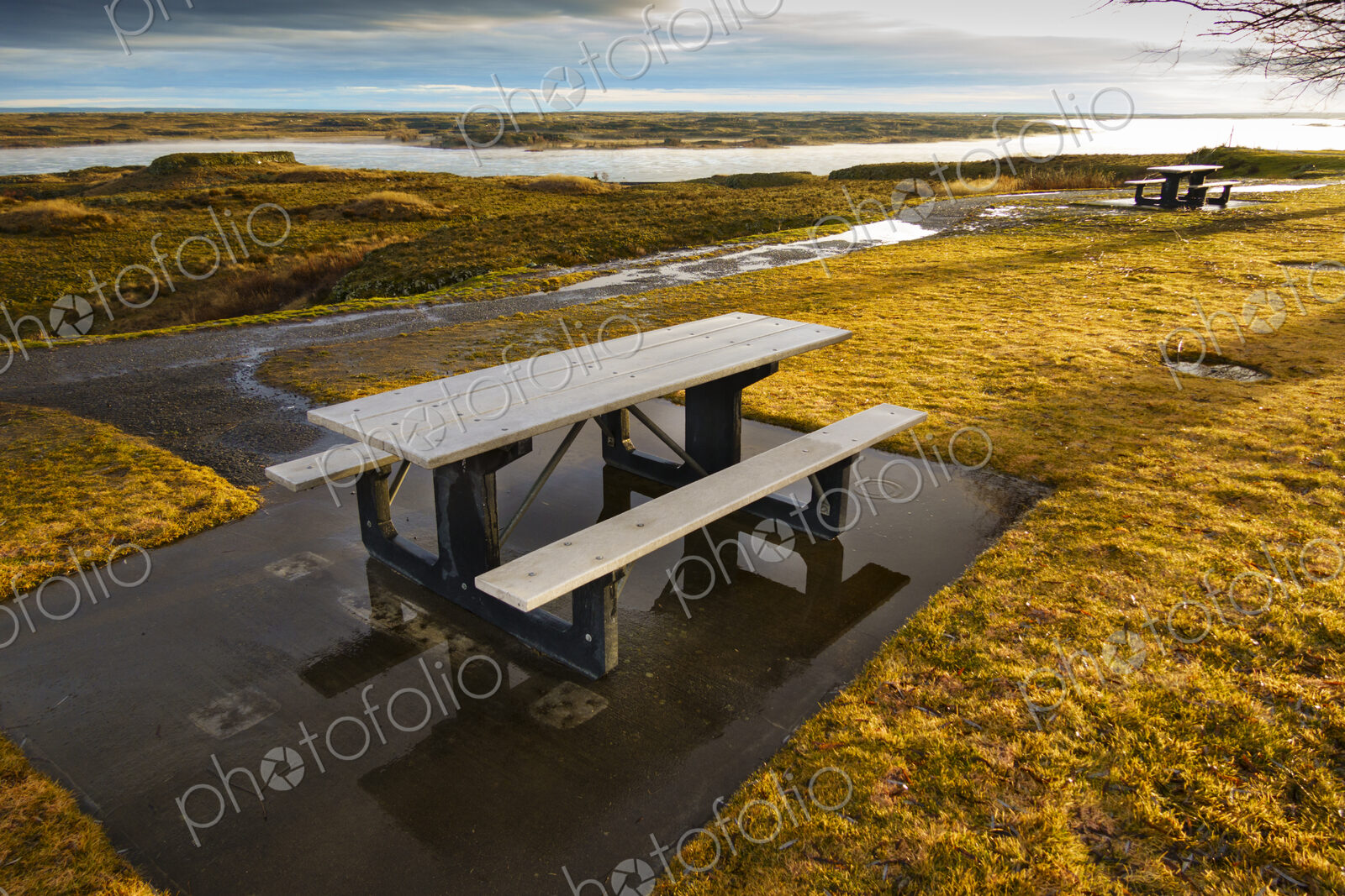 Interstate 90 Highway rest stop and picnic tables at Sprague overlooking a lake.
