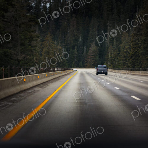 Interstate 90 near Snoqualmie Pass, a single vehicle on the road.