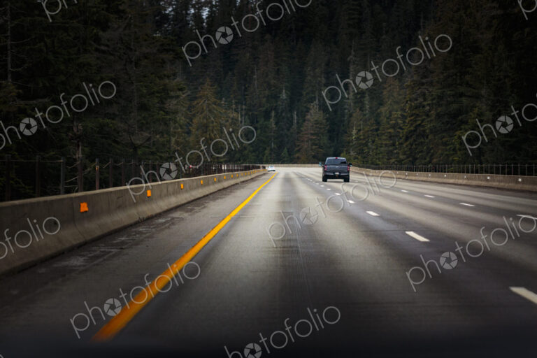 Interstate 90 near Snoqualmie Pass, a single vehicle on the road.