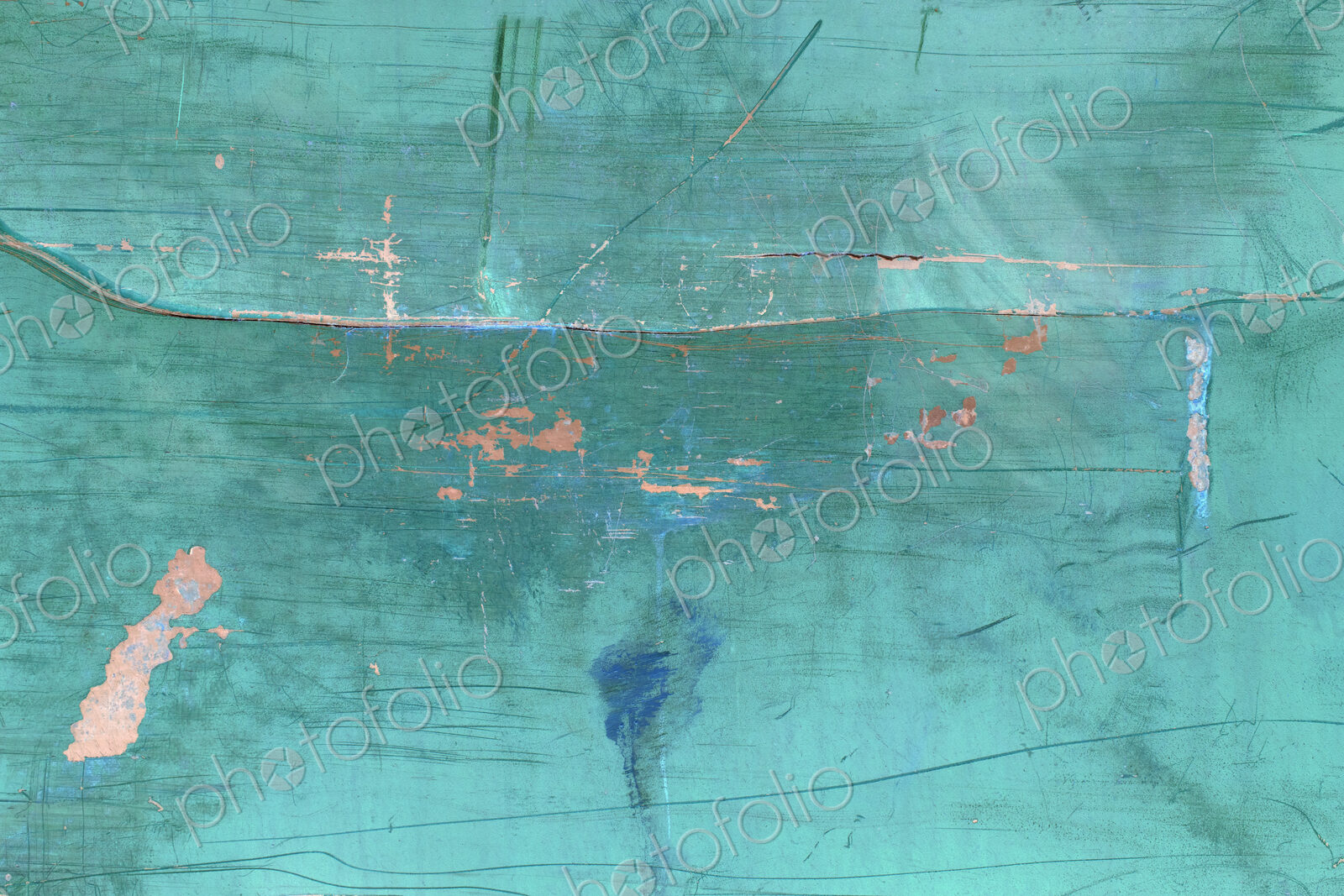 Inverted image of scratch marks and peeling blue paint on metal wall