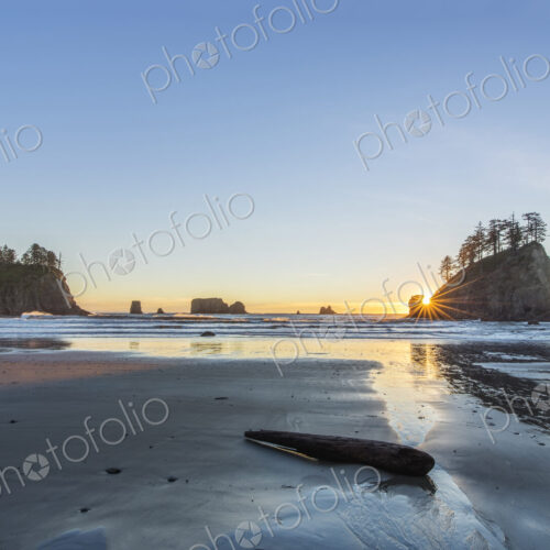 Islands with trees off Second Beach at low tide at sunset. Islands with trees off Second Beach at low tide at sunset.