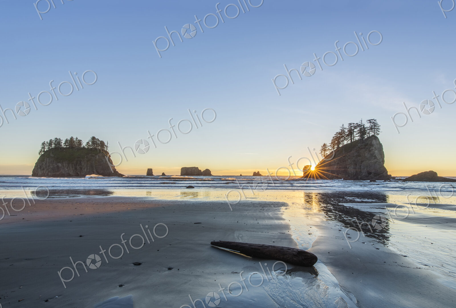 Islands with trees off Second Beach at low tide at sunset.
