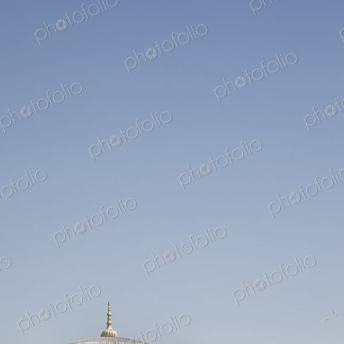 Istanbul, view of a historic building, a dome and a gold colour roof finial. Istanbul, view of a historic building, a dome and a gold colour roof finial.