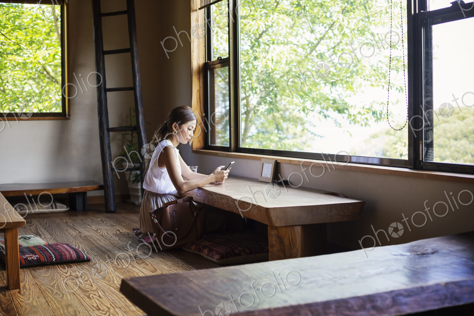 Japanese woman sitting at a table in a Japanese restaurant.