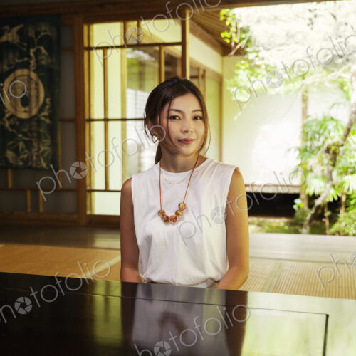Japanese woman sitting in Buddhist temple. Japanese woman sitting in Buddhist temple.