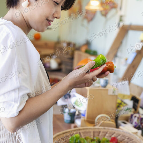 Japanese women shopping fresh vegetables in a farm shop. Japanese women shopping fresh vegetables in a farm shop.