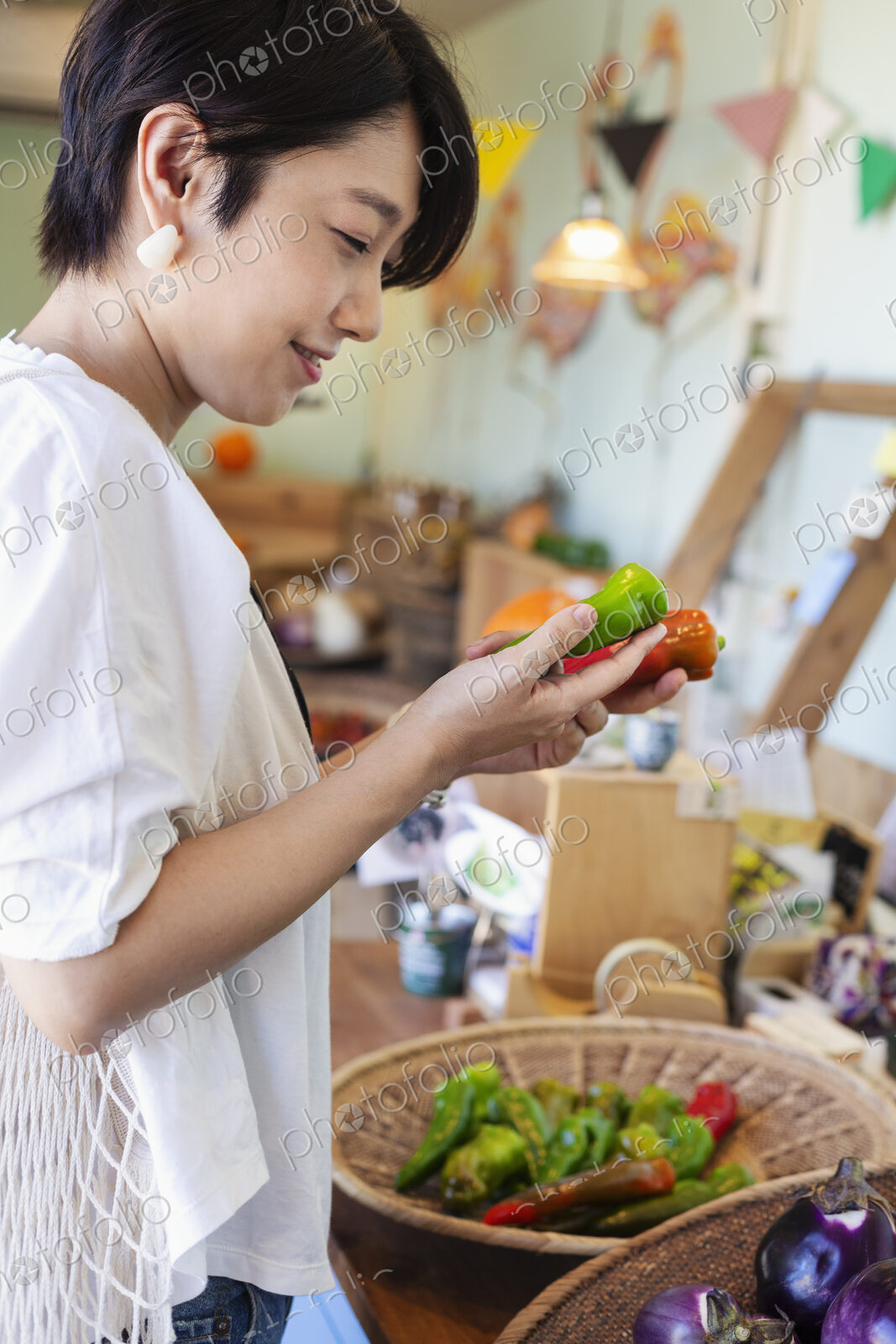 Japanese women shopping fresh vegetables in a farm shop.