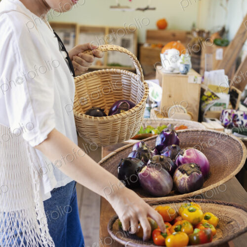 Japanese women shopping fresh vegetables in a farm shop. Japanese women shopping fresh vegetables in a farm shop.