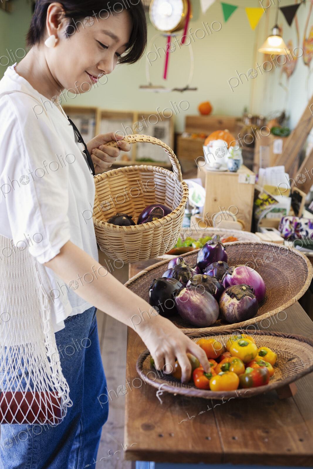 Japanese women shopping fresh vegetables in a farm shop.