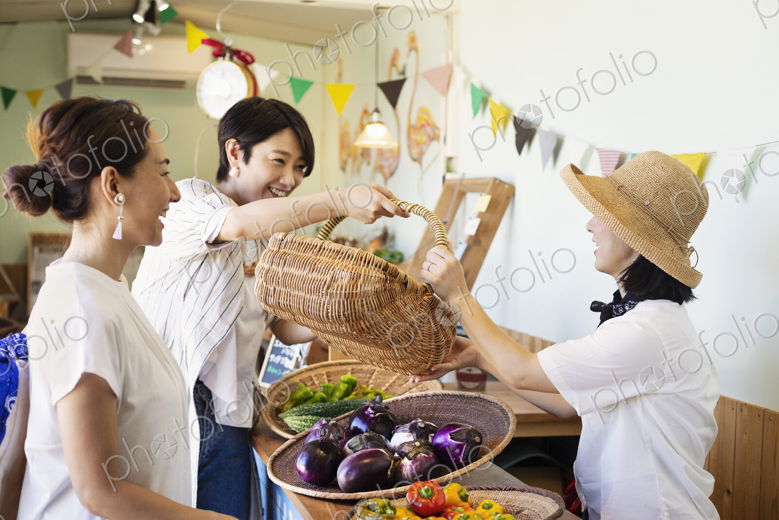 Japanese women shopping fresh vegetables in a farm shop.