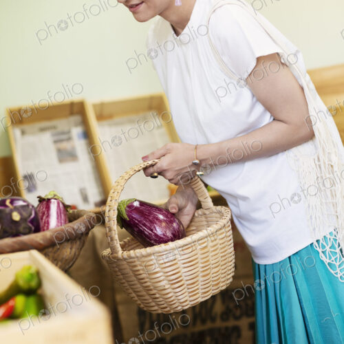 Japanese women shopping fresh vegetables in a farm shop. Japanese women shopping fresh vegetables in a farm shop.