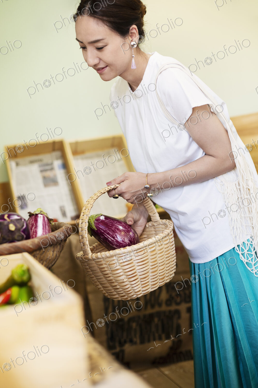Japanese women shopping fresh vegetables in a farm shop.