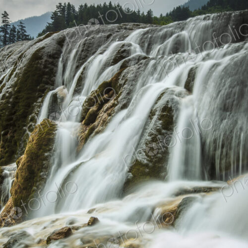 Jiuzhaigou Waterfall , water cascading over rocks in a national park, an Unesco world… Jiuzhaigou Waterfall , water cascading over rocks in a national park, an Unesco world…
