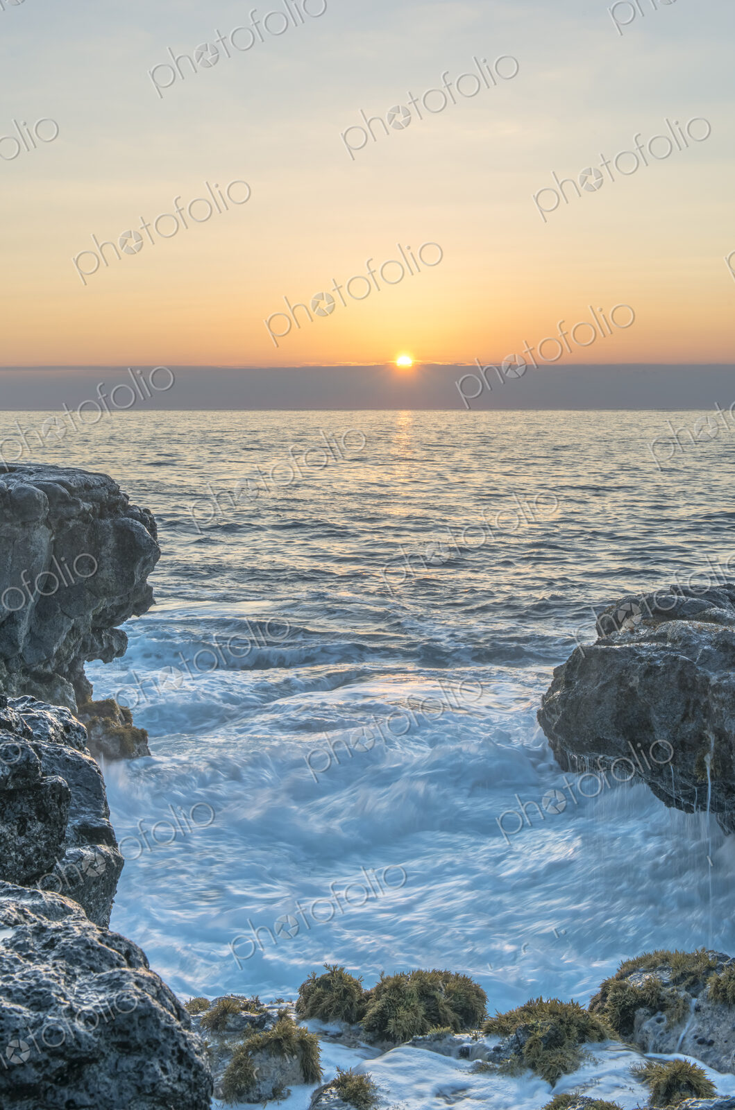 Kauai, Mokolea Point, view over the sea at sunrise over the water.
