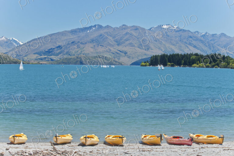 Kayaks docked along beach, Lake Wanaka, Otago, New Zealand