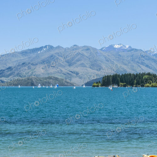 Kayaks docked along beach, Lake Wanaka, Otago, New Zealand Kayaks docked along beach, Lake Wanaka, Otago, New Zealand