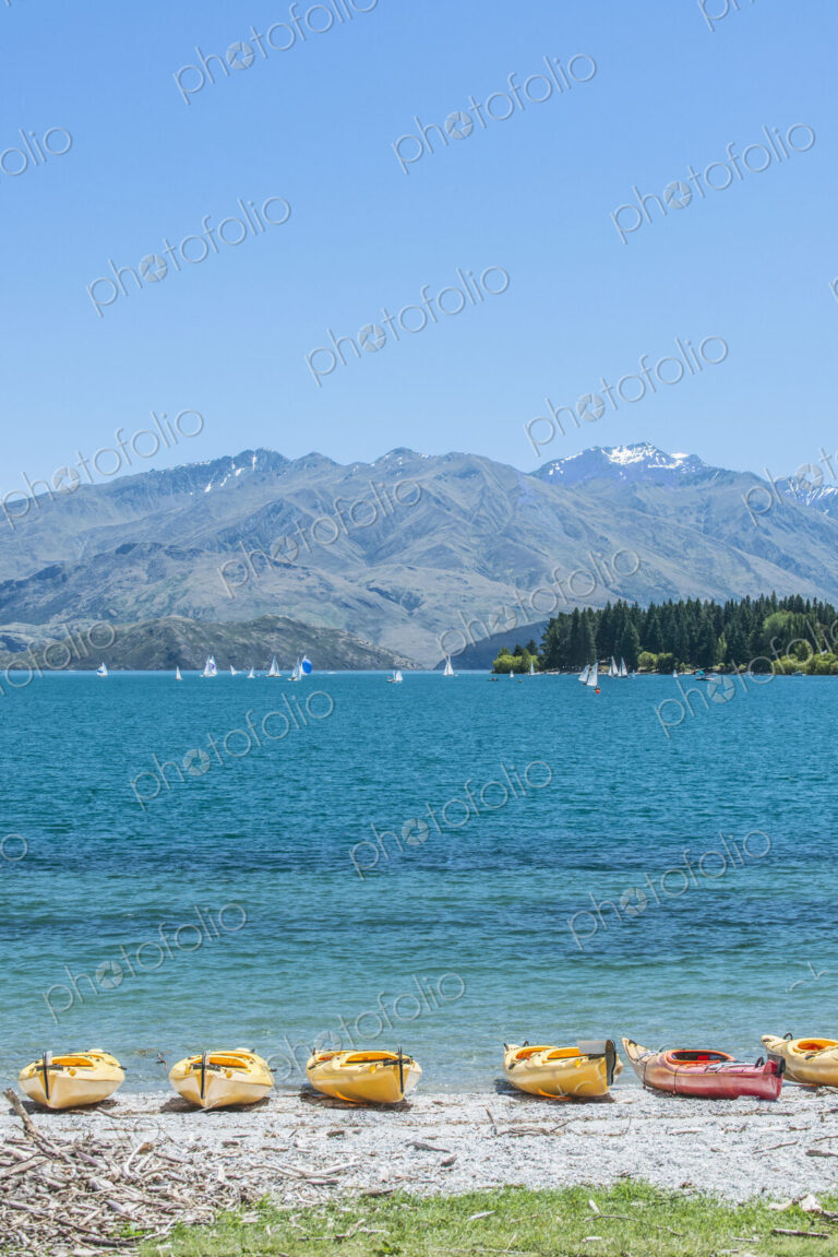 Kayaks docked along beach, Lake Wanaka, Otago, New Zealand