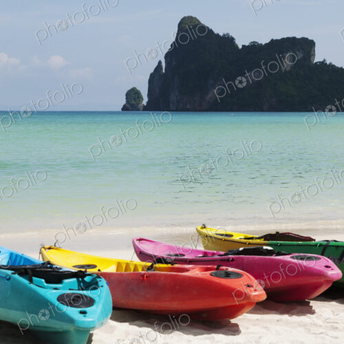 Kayaks for hire on a beach resort in the Andaman islands off the cost of Thailand.