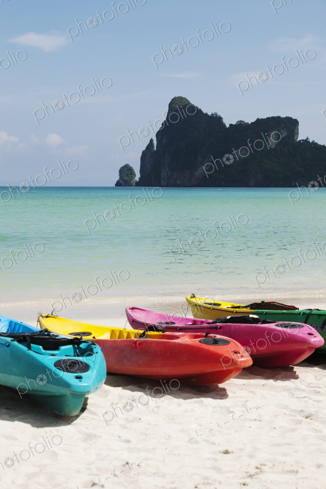 Kayaks for hire on a beach resort in the Andaman islands off the cost of Thailand.