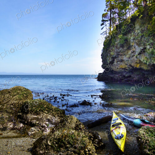Kayaks on shore of a pocket beach along the Strait of Juan de Fuca, Port Angeles Kayaks on shore of a pocket beach along the Strait of Juan de Fuca, Port Angeles