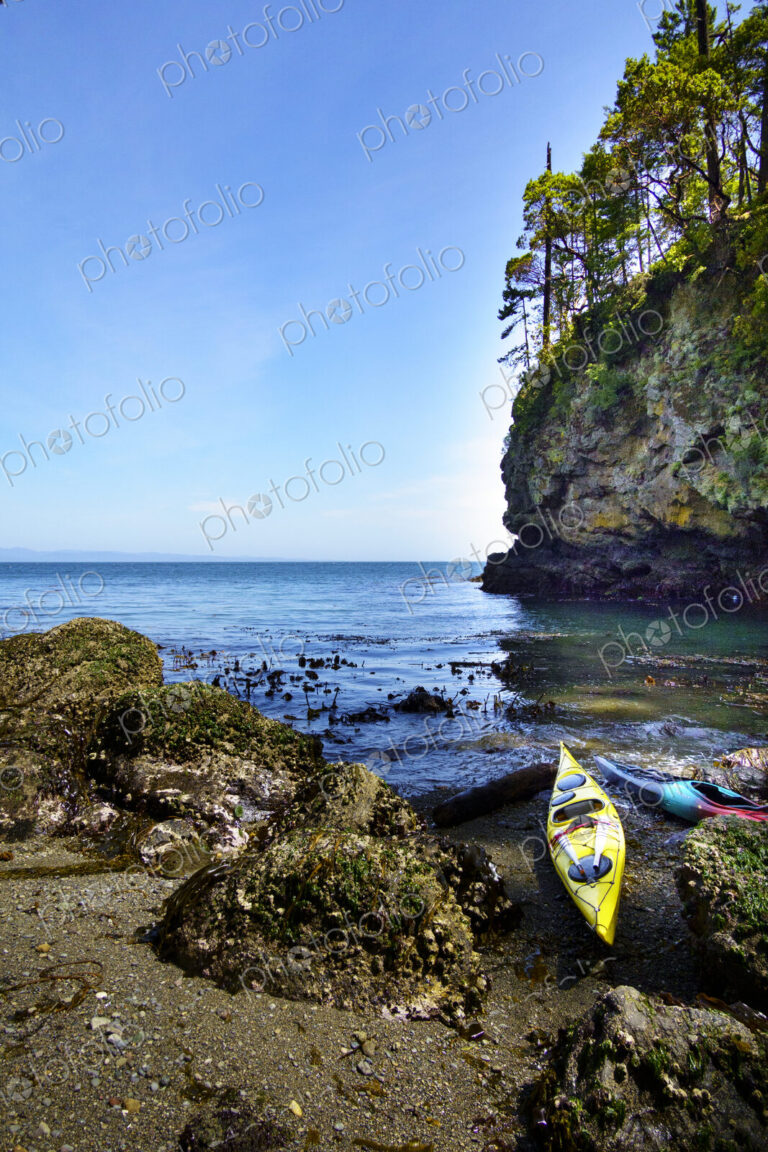 Kayaks on shore of a pocket beach along the Strait of Juan de Fuca, Port Angeles