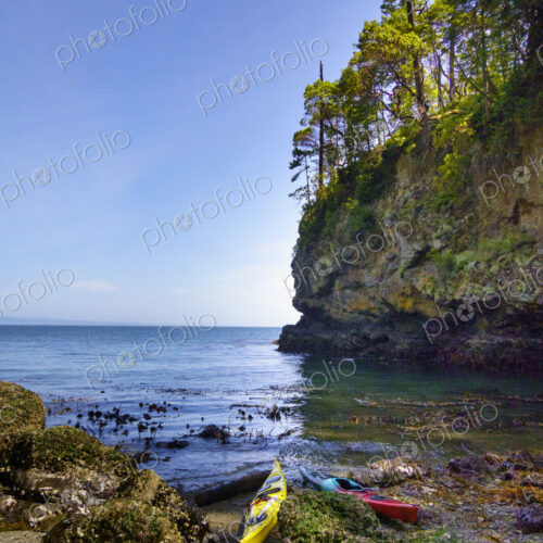Kayaks on shore of a pocket beach along the Strait of Juan de Fuca, Port Angeles Kayaks on shore of a pocket beach along the Strait of Juan de Fuca, Port Angeles