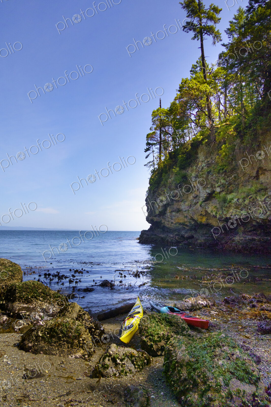 Kayaks on shore of a pocket beach along the Strait of Juan de Fuca, Port Angeles
