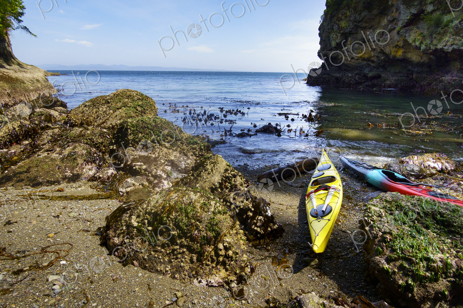 Kayaks on shore of a pocket beach along the Strait of Juan de Fuca, Port Angeles