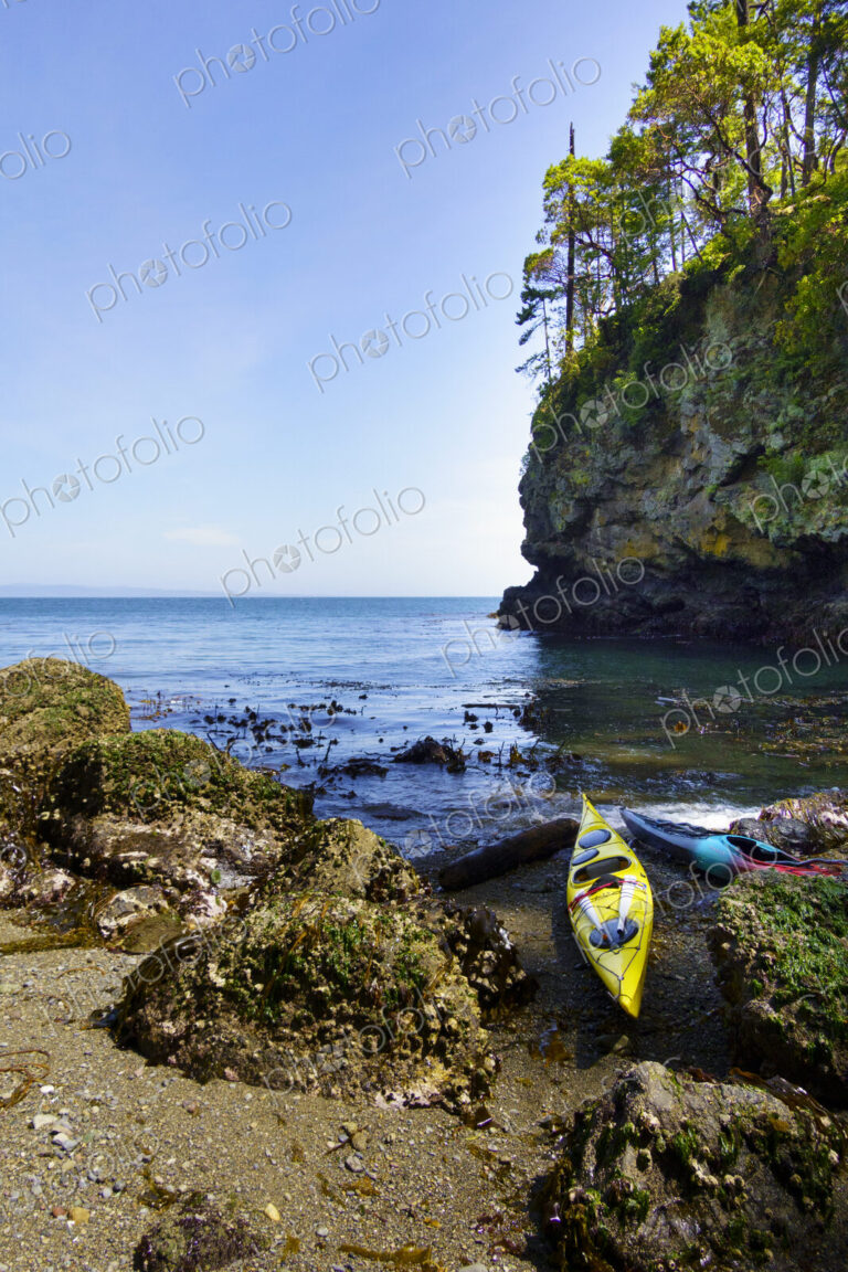 Kayaks on shore of pocket beach along the Strait of Juan de Fuca, Port Angeles