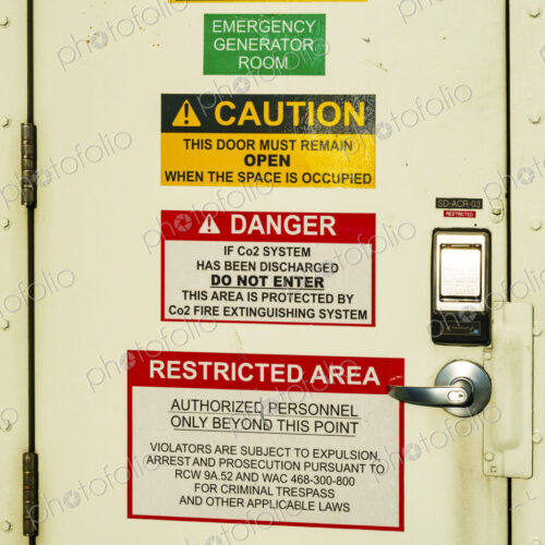 Kingston to Edmonds 'Spokane' ferry on Puget Sound, a door covered with important signs.