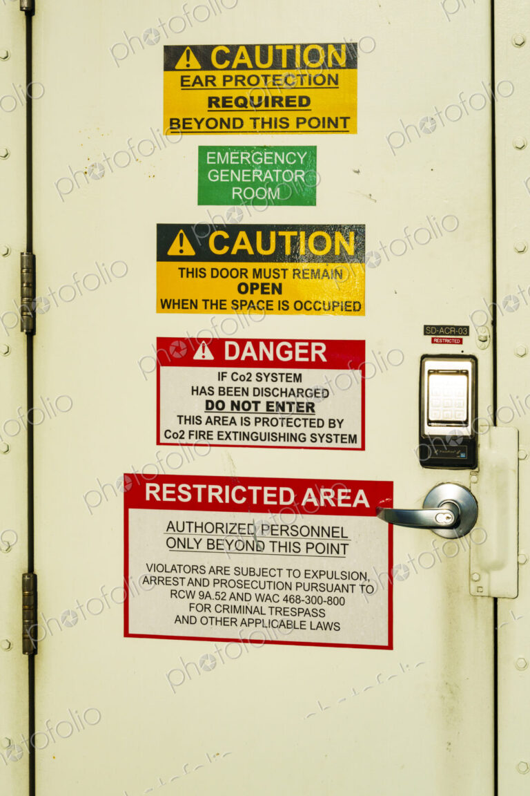 Kingston to Edmonds 'Spokane' ferry on Puget Sound, a door covered with important signs.