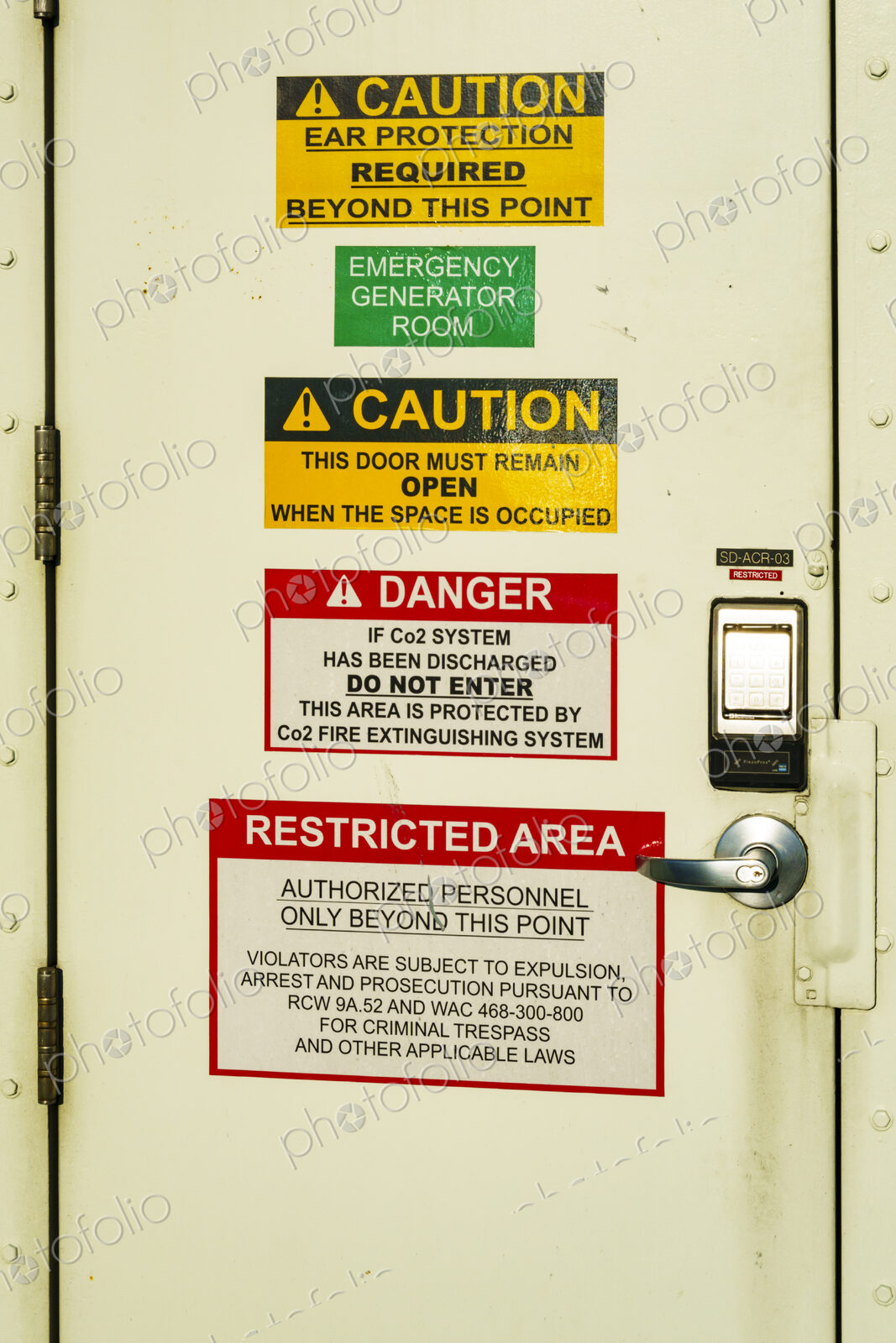 Kingston to Edmonds ‘Spokane’ ferry on Puget Sound, a door covered with important signs.