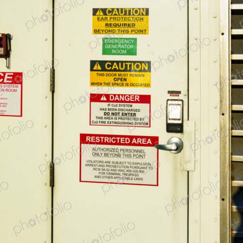 Kingston to Edmonds 'Spokane' ferry on Puget Sound, a door covered with important signs.