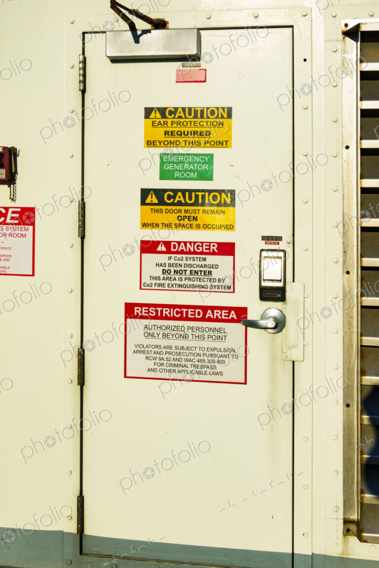 Kingston to Edmonds 'Spokane' ferry on Puget Sound, a door covered with important signs.