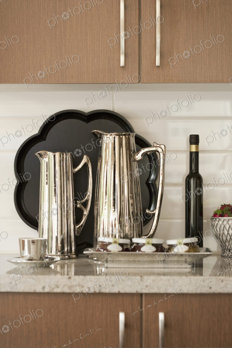 Kitchen Counter, close up of metal jugs, coffee pots.