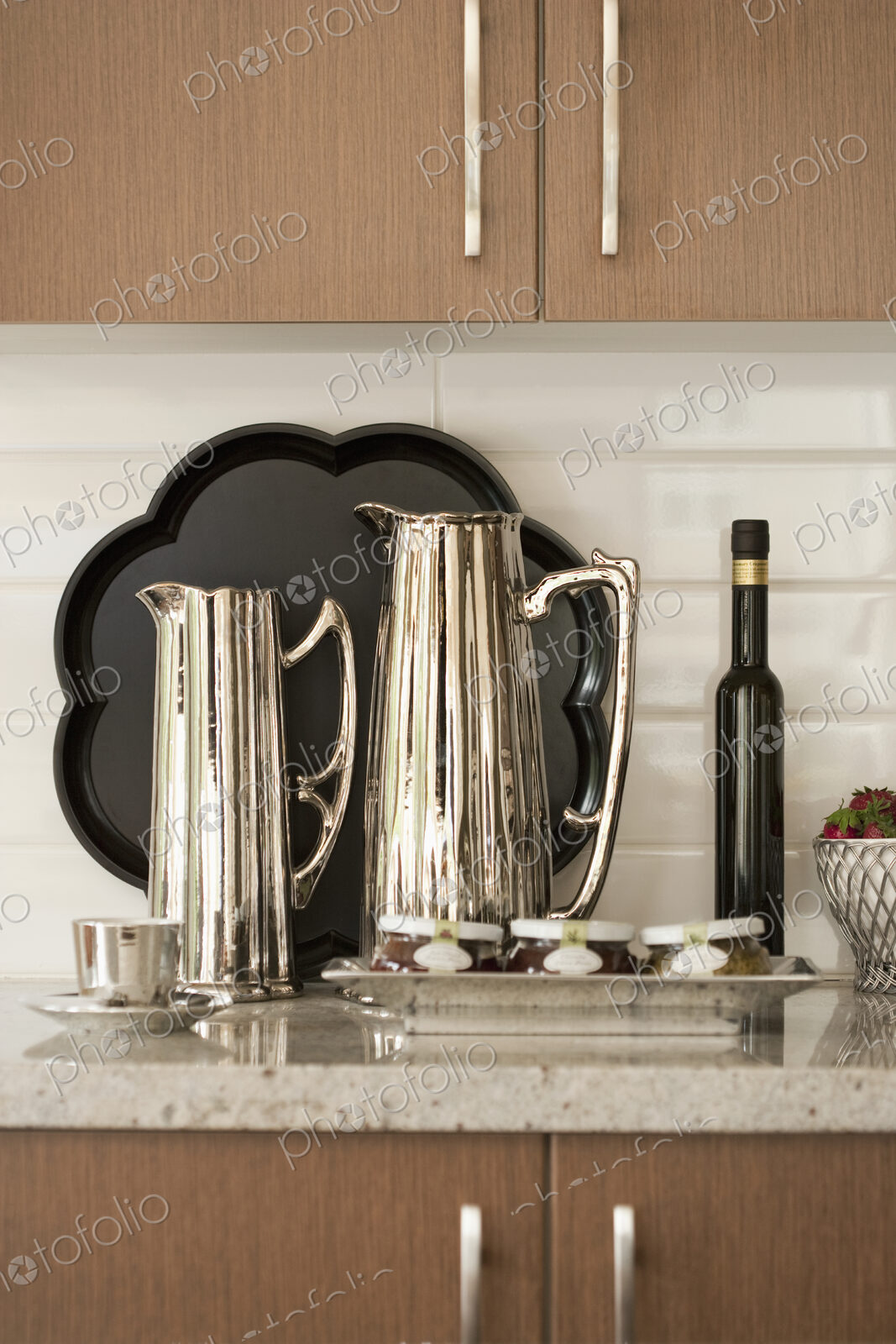 Kitchen Counter, close up of metal jugs, coffee pots.