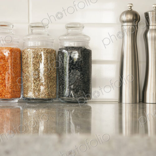 Kitchen Counter, glass storage jars and salt and pepper grinders Kitchen Counter, glass storage jars and salt and pepper grinders