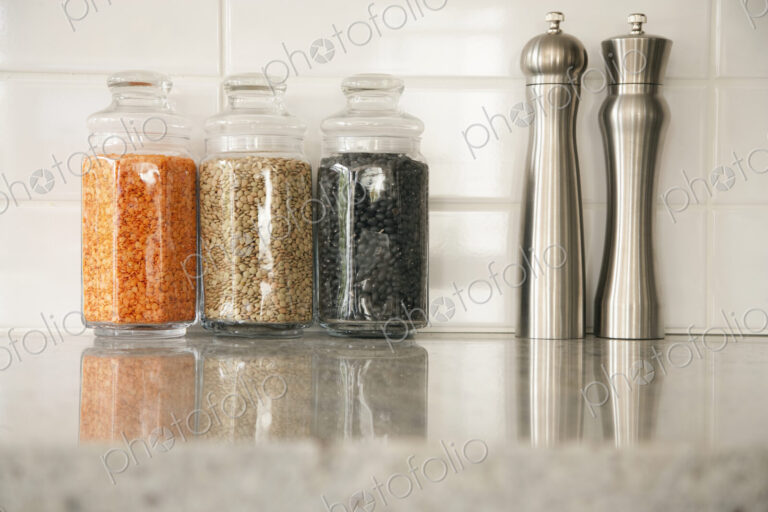 Kitchen Counter, glass storage jars and salt and pepper grinders